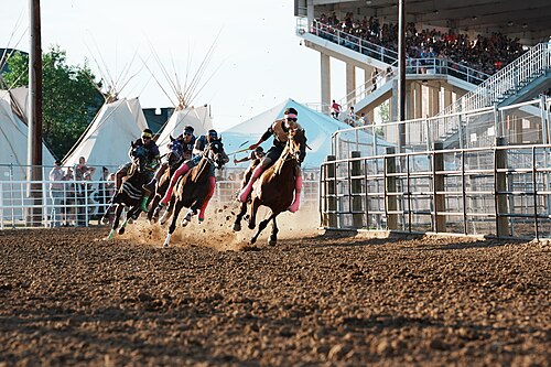 SHERIDAN, WYOMING, UNITED STATES - July 9, 2026: Jace Long Feather, Ryder Abrahamson, Tristan Bird in Ground, Kingston Hugs, and Kalijah Oldson at 2026 Sheridan WYO Rodeo Mens Indian Relay.