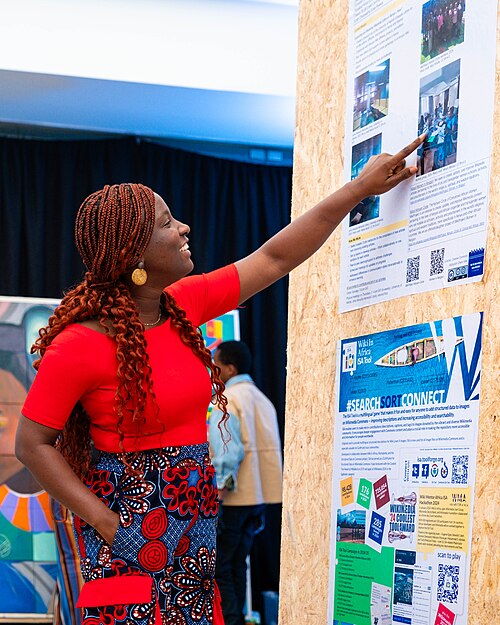 A Photo of Jael Boateng at Wikimania 2025 during the poster session