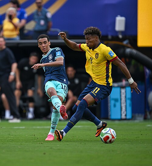 EAST RUTHERFORD, UNITED STATES - June 25: Jamal Musiala #10 of Germany is in action against Kevin Rodriguez #11 of Ecuador during the FIFA World Cup 2026 Group E match between Ecuador  and  Germany on June 25, 2026 MetLife Stadium, East Rutherford, New Jersey