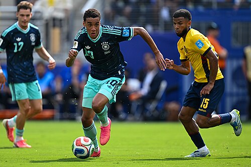 EAST RUTHERFORD, UNITED STATES - June 25: Jamal Musiala #10 of Germany is in action against, Pedro Vite #15 of Ecuador during the FIFA World Cup 2026 Group E match between Ecuador  and  Germany on June 25, 2026 MetLife Stadium, East Rutherford, New Jersey