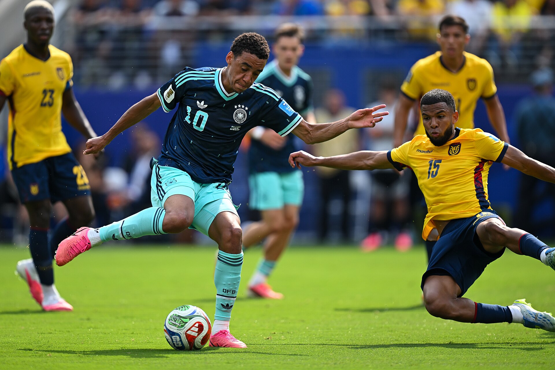 EAST RUTHERFORD, UNITED STATES - June 25: Jamal Musiala #10 of Germany is in action against, Pedro Vite #15 of Ecuador during the FIFA World Cup 2026 Group E match between Ecuador  and  Germany on June 25, 2026 MetLife Stadium, East Rutherford, New Jersey
