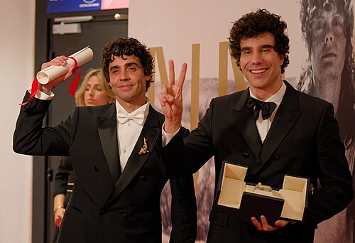 Javier Ambrossi (left) and Javier Calvo (right) at the 2026 Cannes Film Festival winners press conference, holding their award