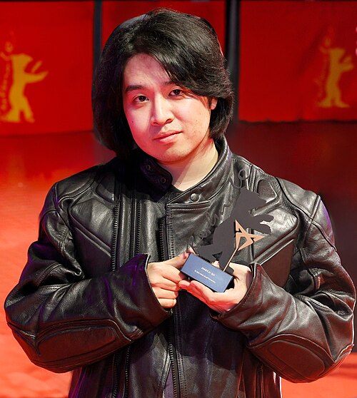 Jingkai Qu pose with the Berlinale Shorts CUPRA Filmmaker Award, endowed with 20,000 euros for Di san xian (Kleptomania) on the red carpet after the Award Ceremony of  Berlinale 2026 in Berlin, Germany
