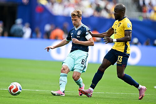 EAST RUTHERFORD, UNITED STATES - June 25: Joshua Kimmich #6 of Germany is in action against Enner Valencia #13 of Ecuador during the FIFA World Cup 2026 Group E match between Ecuador  and  Germany on June 25, 2026 MetLife Stadium, East Rutherford, New Jersey