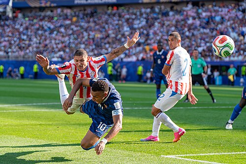Juan Jose Caceres Kylian Mbappe during France v Paraguay at the 2026 FIFA World Cup