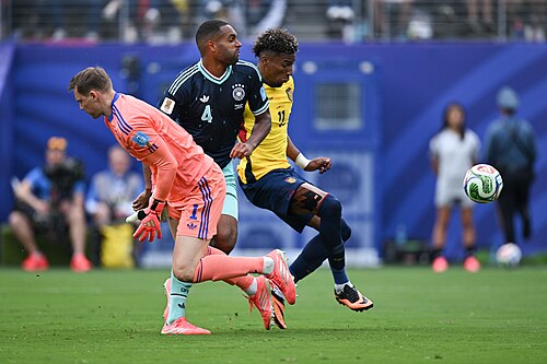 EAST RUTHERFORD, UNITED STATES - June 25: Kevin Rodriguez #11 of Ecuador battles for possession with Jonathan Tah #4 and Goalkeeper Manuel Neuer #1 of Germany during the FIFA World Cup 2026 Group E match between Ecuador  and  Germany on June 25, 2026 MetLife Stadium, East Rutherford, New Jersey