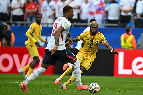 FOXBOROUGH, UNITED STATES - June 23: Ezri Konsa #2 of England is in action against Kwasi Sibo #8 of Ghana during the FIFA World Cup 2026 Group L match between England and Ghana on June 23, 2026 Boston Stadium , Foxborough, Massachusetts