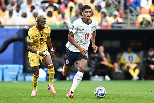 FOXBOROUGH, UNITED STATES - June 23: Kwasi Sibo #8 of Ghana is in action against Jude Bellingham #10 of England during the FIFA World Cup 2026 Group L match between England and Ghana on June 23, 2026 Boston Stadium , Foxborough, Massachusetts