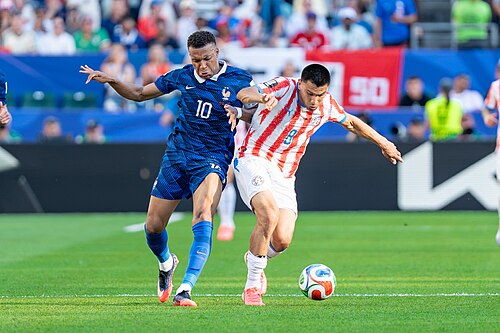 Kylian Mbappe Diego Gomez during France v Paraguay at the 2026 FIFA World Cup
