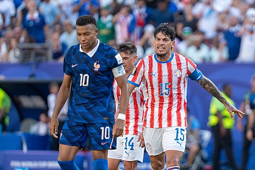 Kylian Mbappe Gustavo Gomez during France v Paraguay at the 2026 FIFA World Cup
