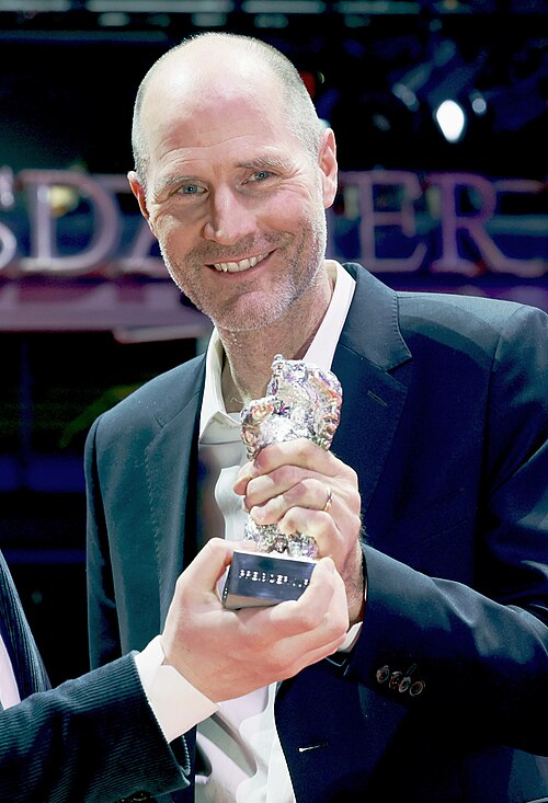 Tristan Goligher and Lance Hammer pose with the Silver Bear Jury Prize for “Queen at Sea” on the red carpet after the Award Ceremony of  Berlinale 2026 in Berlin, Germany