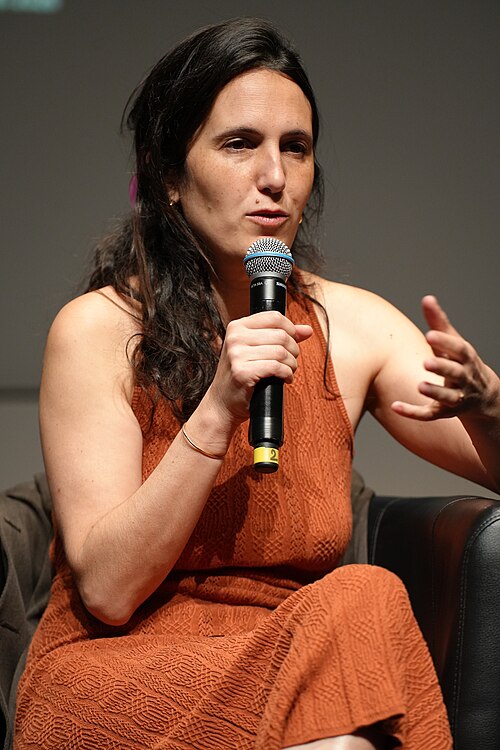 MAY 16, 2026 - Lila Pinell, French filmmaker, speaking at the Q&A of the premiere of her film Shana at the 2026 Cannes Film Festival.
