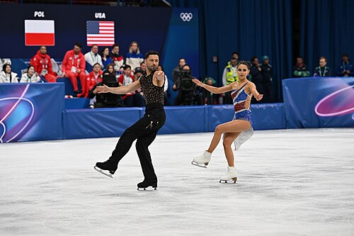MILAN, ITALY - 06 FEBRUARY 2026: Lilah Fear and Lewis Gibson of Great Britain compete during the  Ice Dance Rhythm Dance Team Event  at the Milano Ice Skating Arena at the Olympic Winter Games Milano Cortina 2026  on February 06, 2026 in ,