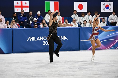 MILAN, ITALY - 06 FEBRUARY 2026: Lilah Fear and Lewis Gibson of Great Britain compete during the  Ice Dance Rhythm Dance Team Event  at the Milano Ice Skating Arena at the Olympic Winter Games Milano Cortina 2026  on February 06, 2026 in ,