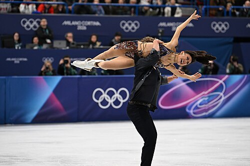 MILAN, ITALY - 06 FEBRUARY 2026: Madison Chock and Evan Bates of United States compete during the  Ice Dance Rhythm Dance Team Event  at the Milano Ice Skating Arena at the Olympic Winter Games Milano Cortina 2026  on February 06, 2026 in ,