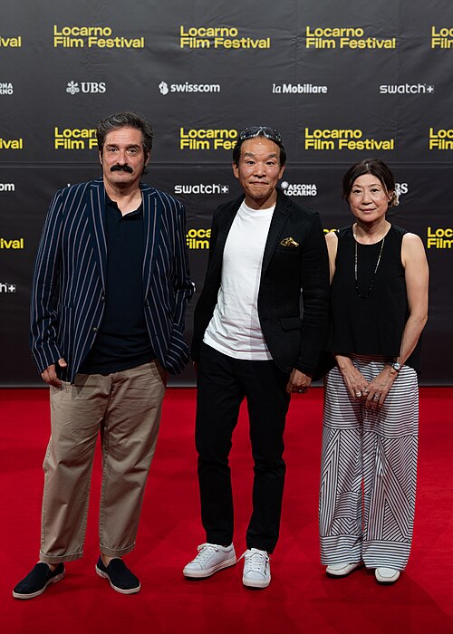 Marco Costantini and Grave of the fireflies representatives on the red carpet at the 79th Locarno Film Festival 2026