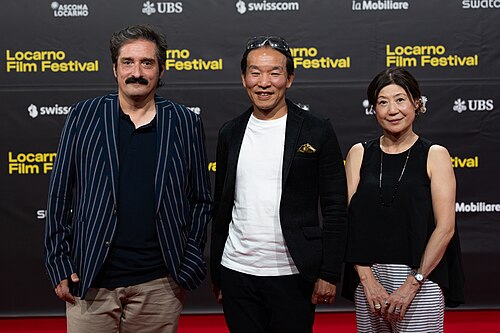 Marco Costantini and Grave of the fireflies representatives on the red carpet at the 79th Locarno Film Festival 2026