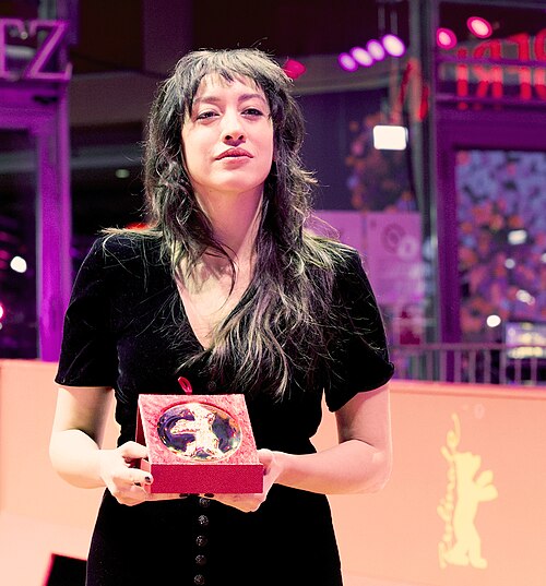 Marie-Rose Osta poses with the Golden Bear for Best Short Film for “Yawman ma walad” (Someday a Child) on the red carpet after the Award Ceremony of Berlinale 2026 in Berlin, Germany