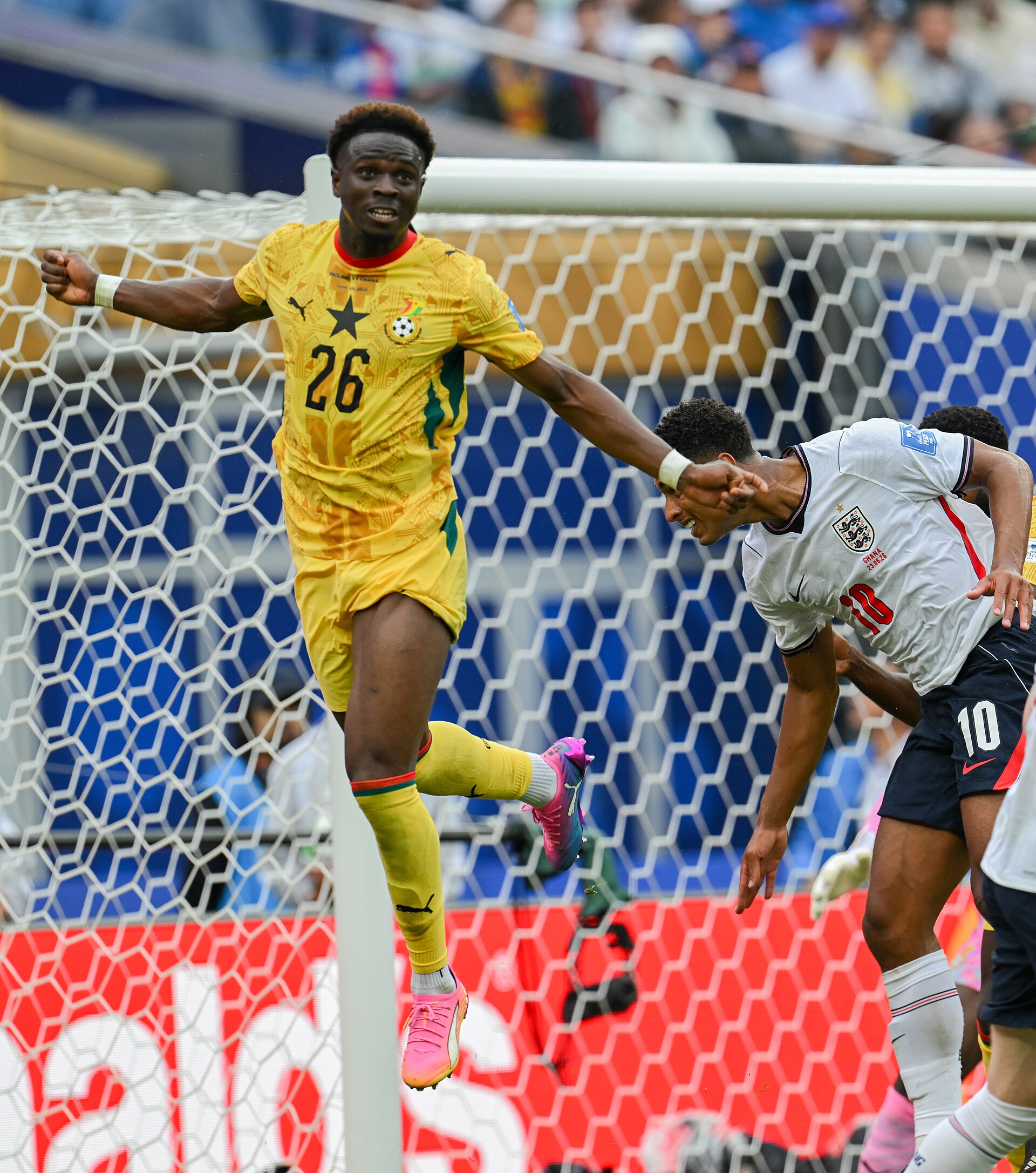FOXBOROUGH, UNITED STATES - June 23: Marvin Senaya #26 of Ghana battles in the air with Jude Bellingham #10 of England during the FIFA World Cup 2026 Group L match between England and Ghana on June 23, 2026 Boston Stadium , Foxborough, Massachusetts