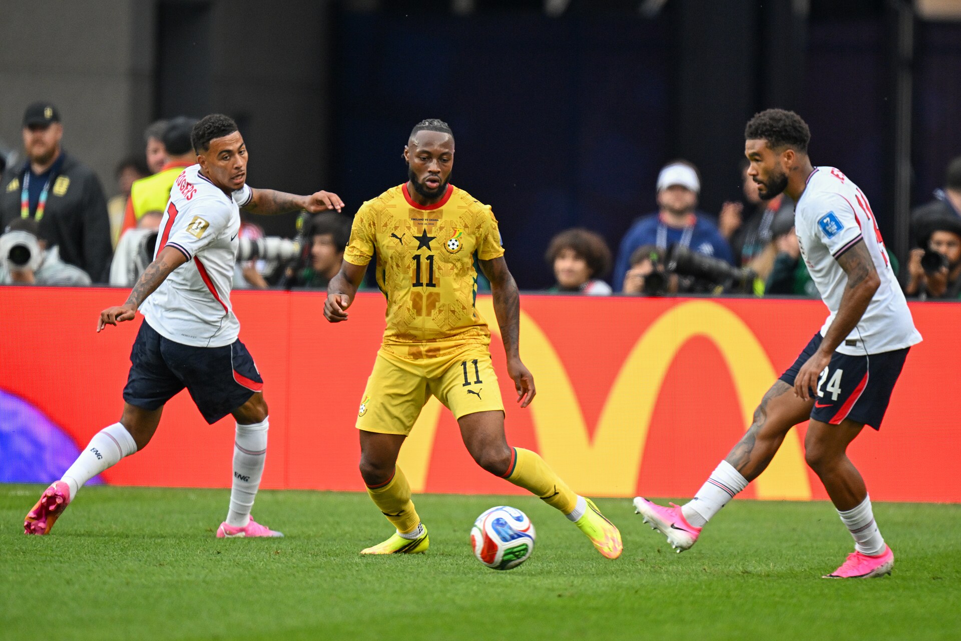FOXBOROUGH, UNITED STATES-June 23: Antoine Semenyo #11 of Ghana (C), and Bukayo Saka #7 (L) Reece James #24 of England in action during the FIFA World Cup 2026 Group L match between England and Ghana on June 23, 2026 Boston Stadium, Foxborough, MA