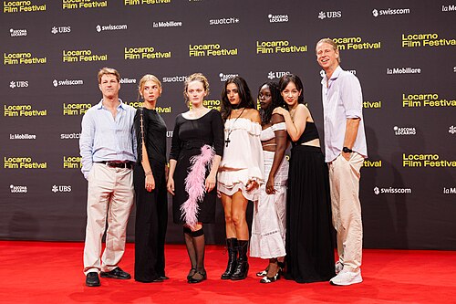 Nikias Chryssos with his cast attend "The Invite" red carpet during the 79th Locarno Film Festival on August 08, 2026 in Locarno, Switzerland.