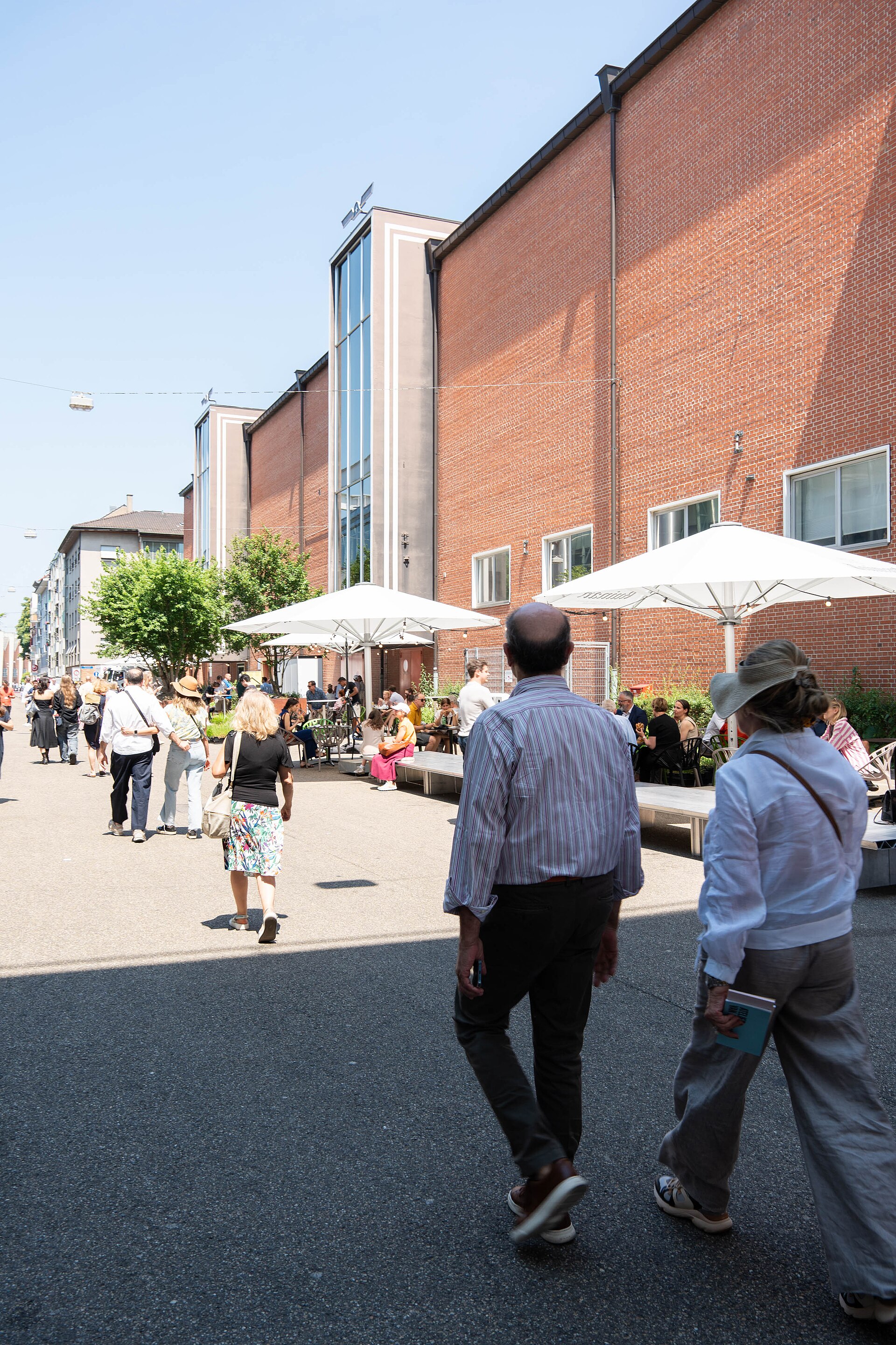 Outdoor dining with food trucks between Halls at Art Basel 2025