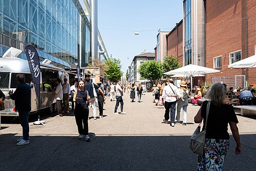Outdoor dining with food trucks between Halls at Art Basel 2025