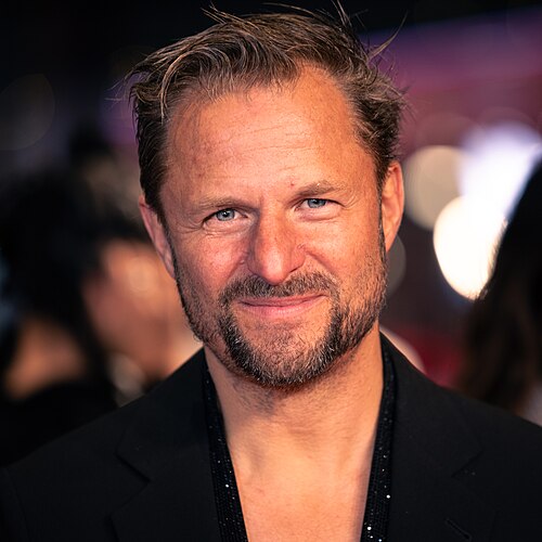 Philipp Hochmair on the red carpet at the 2025 Berlin International Film Festival
