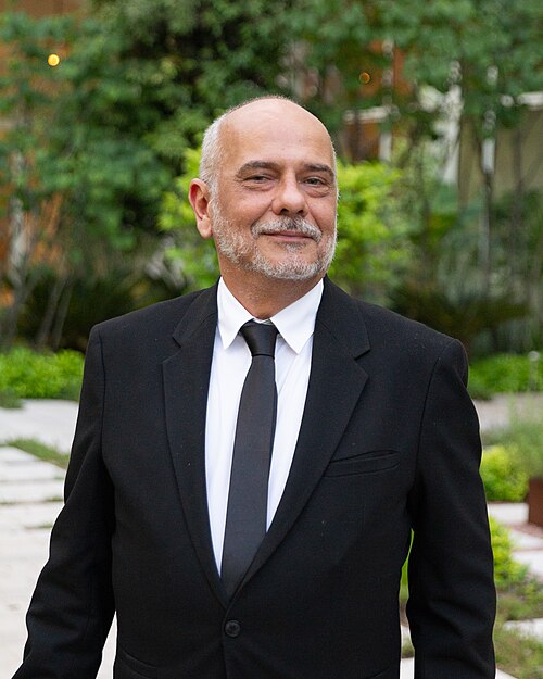 Production Designer Marcos Pedroso at Cannes 2024 Film Festival, attending a party at Carlton Cannes for the world premiere of Motel Destino