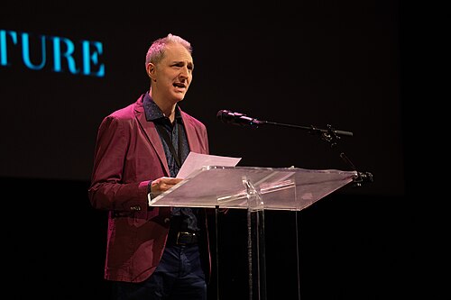 Roland Glasser, translator, at the 2024 National Book Awards finalist reading in the NYU Skirball Center.