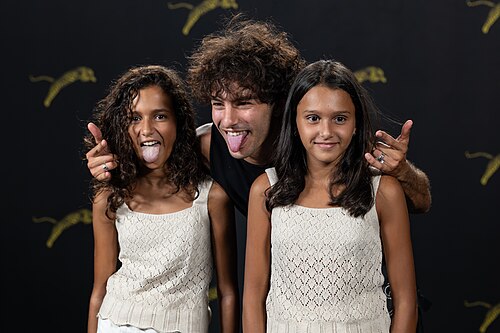 Sayyid El Alami with Douae Butarbuch MZaouki and Hana Butarbuch MZaouki at a PhotoCall at the 2026 Locarno Film Festival.