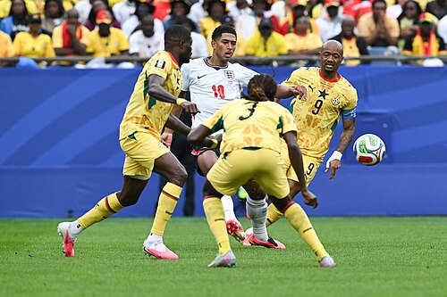 FOXBOROUGH, UNITED STATES - June 23: Thomas Partey #5, Caleb Yirenkyi #3, Jordan Ayew #9 of Ghana battles for possession with Jude Bellingham #10 of England during the FIFA World Cup 2026 Group L match between England and Ghana on June 23, 2026 Boston Stadium , Foxborough, Massachusetts