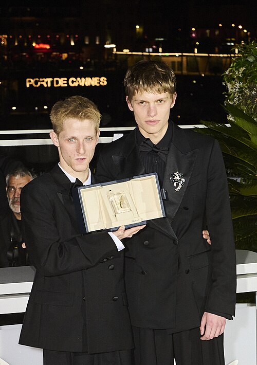 Valentin Campagne and Emmanuel Macchia pose with the Best Actor award for "Coward" during the Palme D'Or winners photocall at the 79th annual Cannes Film Festival