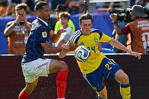 EAST RUTHERFORD, UNITED STATES - June 30: William Saliba #17 is in action against Elliot Stroud #24 of Sweden during the FIFA World Cup 2026 round of 32 match between France  and Sweden on June 30, 2026 MetLife Stadium, East Rutherford, New Jersey