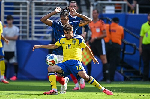 EAST RUTHERFORD, UNITED STATES - June 30: Yasin Ayari #18 of Sweden is in action against Michael Olise #11 of France during the FIFA World Cup 2026 round of 32 match between France  and Sweden on June 30, 2026 MetLife Stadium, East Rutherford, New Jersey