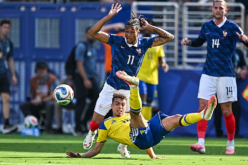 EAST RUTHERFORD, UNITED STATES - June 30: Yasin Ayari #18 of Sweden is in action against Michael Olise #11 of France during the FIFA World Cup 2026 round of 32 match between France  and Sweden on June 30, 2026 MetLife Stadium, East Rutherford, New Jersey