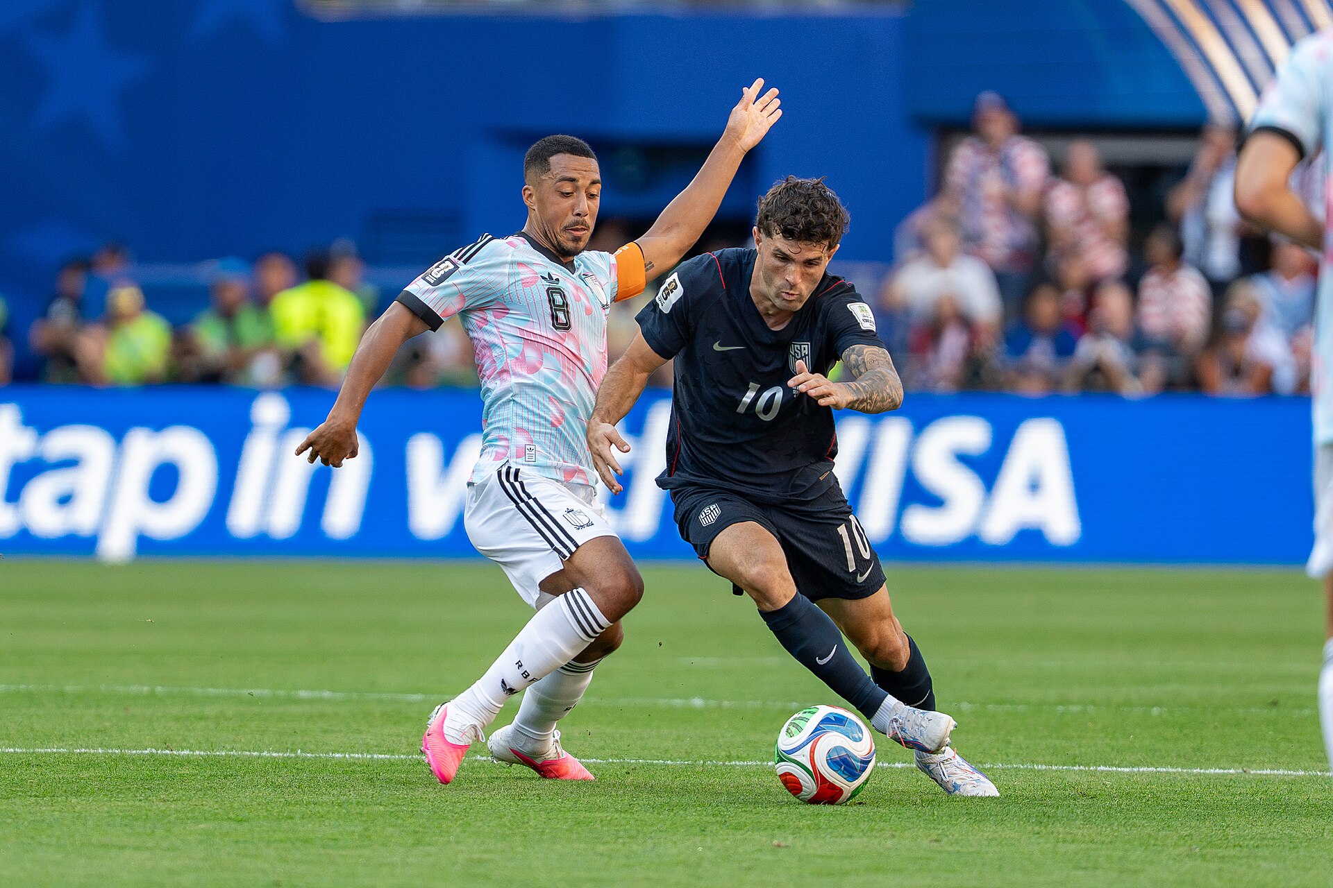 Youri Tielemans Christian Pulisic during Belgium v United States at the 2026 FIFA World Cup