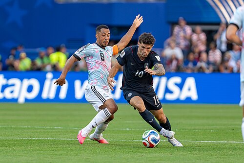 Youri Tielemans Christian Pulisic during Belgium v United States at the 2026 FIFA World Cup