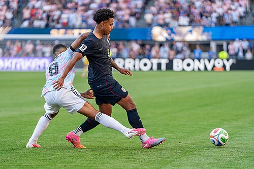 Youri Tielemans Weston McKennie during Belgium v United States at the 2026 FIFA World Cup